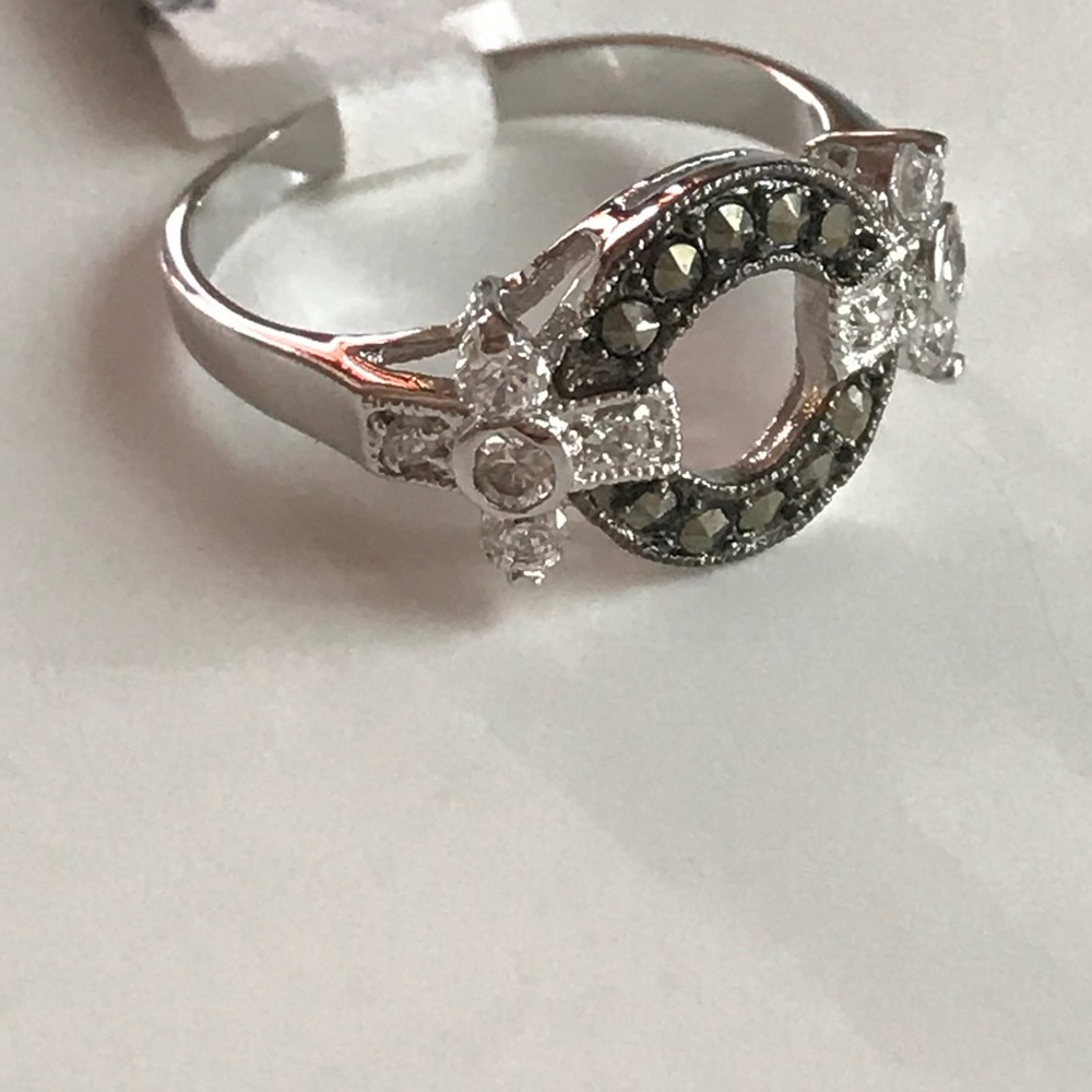 Silver rhodium and marcasite ring with CZ.